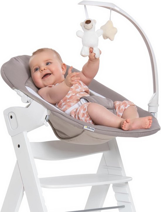 2-in-1 Evoluerende Kinderstoel voor Pasgeborenen tot 9 kg met Speelboog en Stoelverkleiner, Beige van Maxi-Cosi