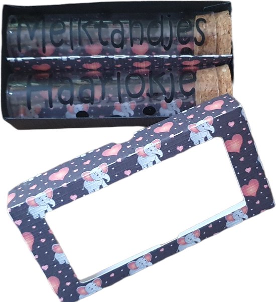 Melktanden- en haarlokflesje in zwarte olifantjes verpakking van Kidooz.